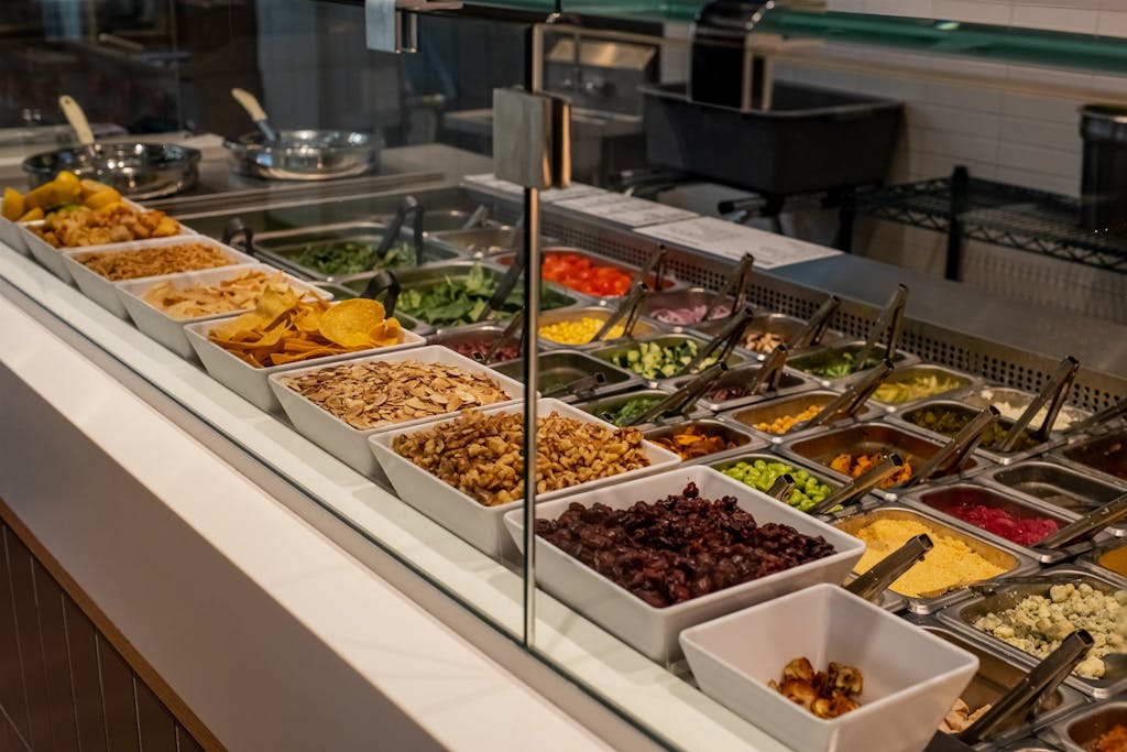 Colorful salad bar offering a variety of fresh toppings and ingredients.